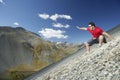 Man Sliding Down Scree Field Royalty Free Stock Photo