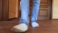 A man in slippers walks on the floor in the house Royalty Free Stock Photo