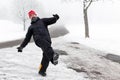 Man is slipping on a icy road