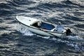 Man in small motorboat Royalty Free Stock Photo