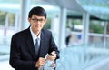 Man on smart phone - young business man. Casual urban profession Royalty Free Stock Photo