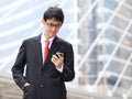 Man on smart phone - young business man. Casual urban profession Royalty Free Stock Photo