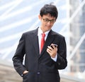 Man on smart phone - young business man. Casual urban profession Royalty Free Stock Photo