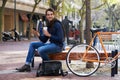 Man, smartphone and coffee and bike for travel and carbon footprint, communication and cycling outdoor. Eco friendly