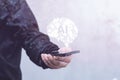 Man with smartphone displaying a holographic AI brain. Concept artificial intelligence and technology innovation