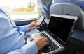 Man with smartphone and laptop in travel bus Royalty Free Stock Photo