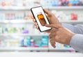 Man with smartphone ordering medications online Royalty Free Stock Photo