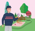 Man with smartphone table grill food blanket picnic