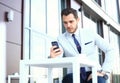 Man on smartphone - young business man talking on smart phone. Casual urban professional businessman using mobile cell Royalty Free Stock Photo