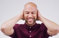 Man, smile and cover ears in studio for peace of mind, noise and calm. African person, happy and not listening to sound Royalty Free Stock Photo