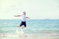 A man smile and jump in sea water and water splash. Travel summer, relax Concept Royalty Free Stock Photo