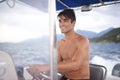 Man, smile and outdoor on yacht, boat and sailing at ocean, sea and water on holiday by seascape in Venice. Italian male Royalty Free Stock Photo