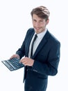 Man points to the calculator and looks at the camera Royalty Free Stock Photo