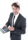 man points to the calculator and looks at the camera Royalty Free Stock Photo