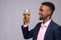 man smiles while holding a wine glass Royalty Free Stock Photo