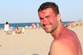 Man smiling while getting sunburned Royalty Free Stock Photo