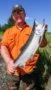 Man Smiling Holding Alaska Silver Salmon