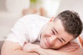 Man smiling to camera relaxing in his living room Royalty Free Stock Photo