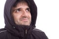 Man smiling in winter jacket on white background