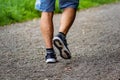 Man with sneakers running on a path, helathy activity to make exercice