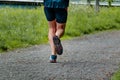 Man with sneakers running on a path, helathy activity to make exercice