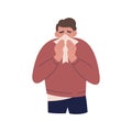 Man sneezes and blows his nose into a handkerchief. Sick guy suffers from allergies or a cold Royalty Free Stock Photo