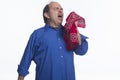 Man sneezing into his handkerchief, horizontal