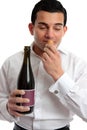 Man sniffing wine cork