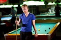 Man with snooker stick Royalty Free Stock Photo