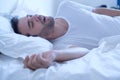 Man snoring because of apnea lying in the bed Royalty Free Stock Photo