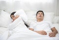 Man snoring, woman can not sleep in bed at home Royalty Free Stock Photo