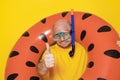 Man with snorkel and inflatable swim ring on yellow background Royalty Free Stock Photo