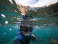 Man in snorkel mask doing selfie underwater. Adventure and travel concept.