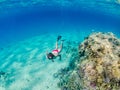 Man snorkeling and freediving near the coral reef edge in Red Sea Royalty Free Stock Photo