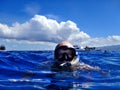 Man snorkeling in warm tropical waters