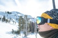 Man on with snow goggles on a ski lift, facing left kirkwood resort, California, USA January 4, 2020 Royalty Free Stock Photo