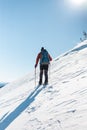 Man in snow snowshoes.