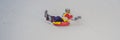 Man snow tubing from hill. winter activity concept BANNER, LONG FORMAT