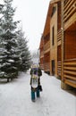 Man with a snowboard on a backpack with his back to the camera Royalty Free Stock Photo