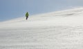 Man with snowboard hiking up the snow-covered slope in Carpathian, Ukraine. Royalty Free Stock Photo