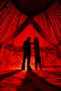 Man with snowboard inside Yurt nomadic house with red light