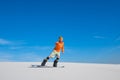 Man on snowboard, riding on sand slope. Royalty Free Stock Photo