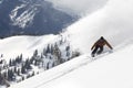 Man Snowboarding Down Hill