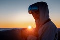 a man in snowboarding gear holding something in his hands Royalty Free Stock Photo