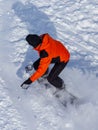 A man snowboarding a mountain in the snow in winter