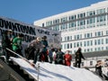 Man snowboards down ramp during Downtown Throwdown event
