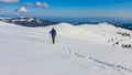 Kor Alps - Man in snowshoes on snow covered mountains of Kor Alps, Lavanttal Alps, Carinthia Styria, Austria. Winter wonderland Royalty Free Stock Photo