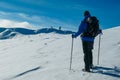 Kor Alps - Man in snowshoes on the way to majestic summit peak Grosser Speikogel in Kor Alps, Lavanttal Alps Royalty Free Stock Photo