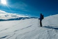 Kor Alps - Man in snowshoes on the way to majestic summit peak Grosser Speikogel in Kor Alps, Lavanttal Alps