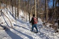 A Man Snowshoes Through the Woods